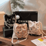 Chanel 22 Mini Shiny Leather Handbag with Decorative Charms Black - Image 2